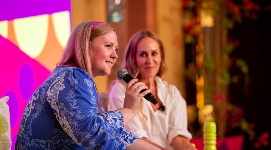 Author Rebecca Yarros speaking on a panel