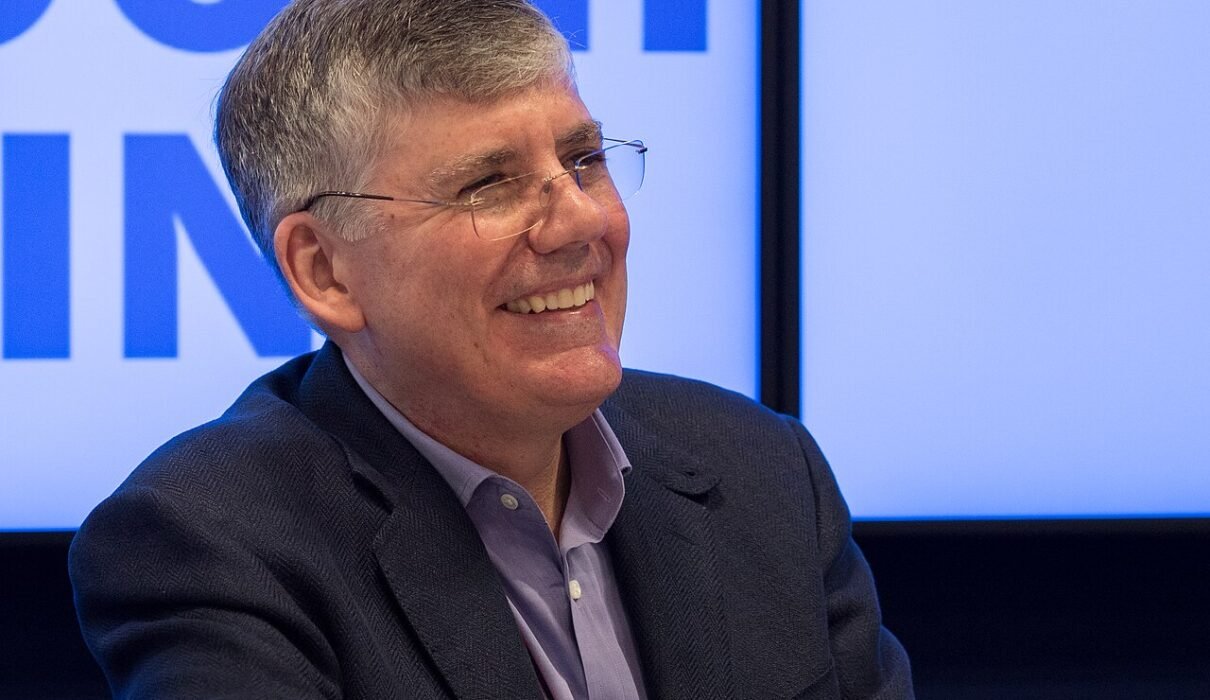 Author Rick Riordan smiling at an event