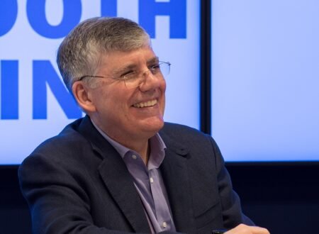 Author Rick Riordan smiling at an event
